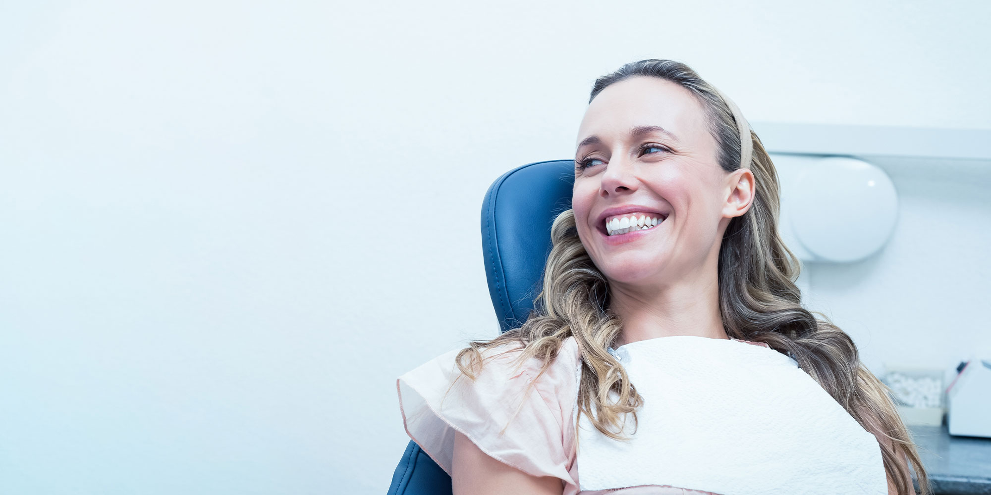A relaxed patient smiling comfortably in the dental chair at United Dental in Lowell, MA
